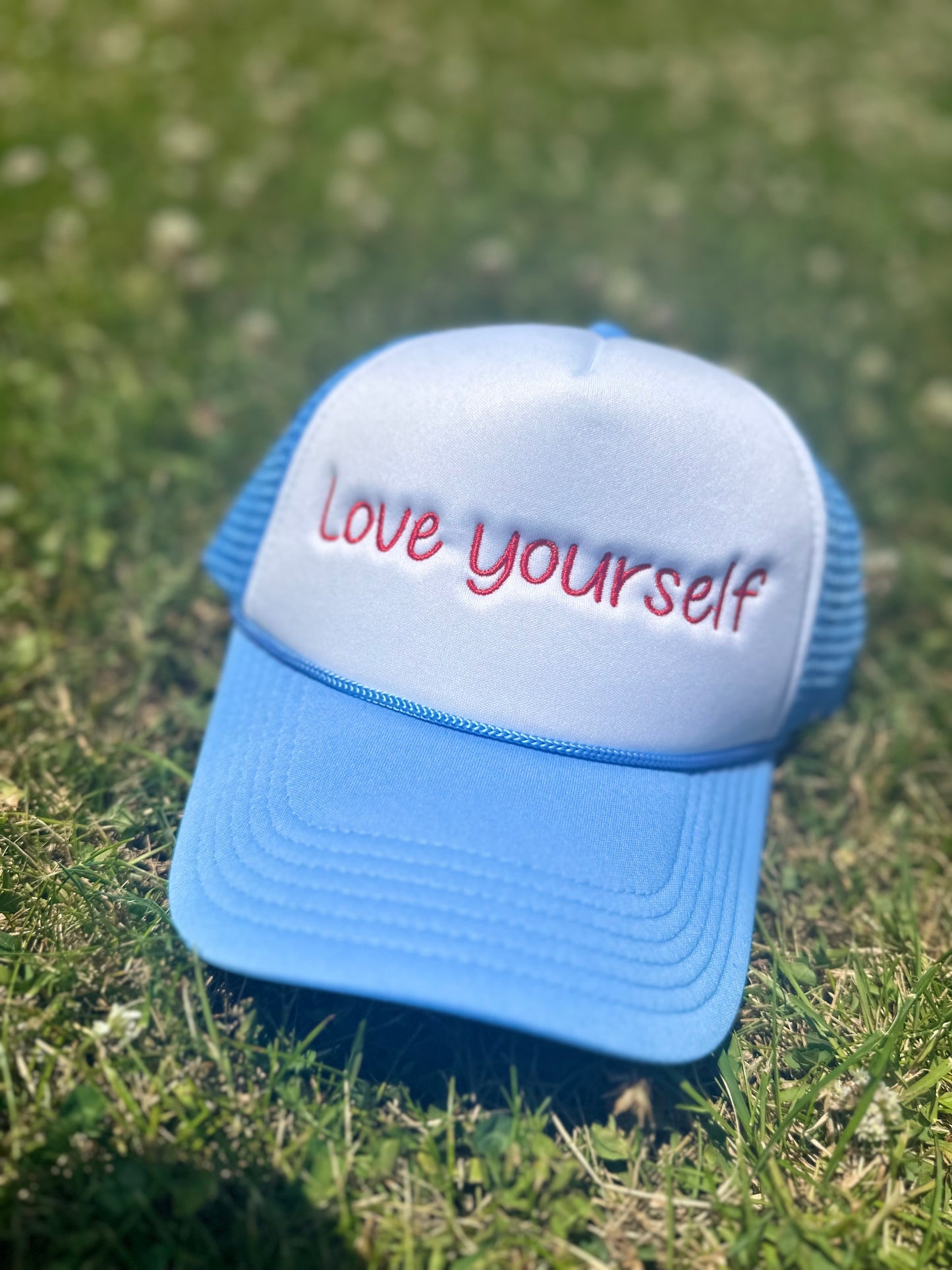 Love yourself Trucker Hat