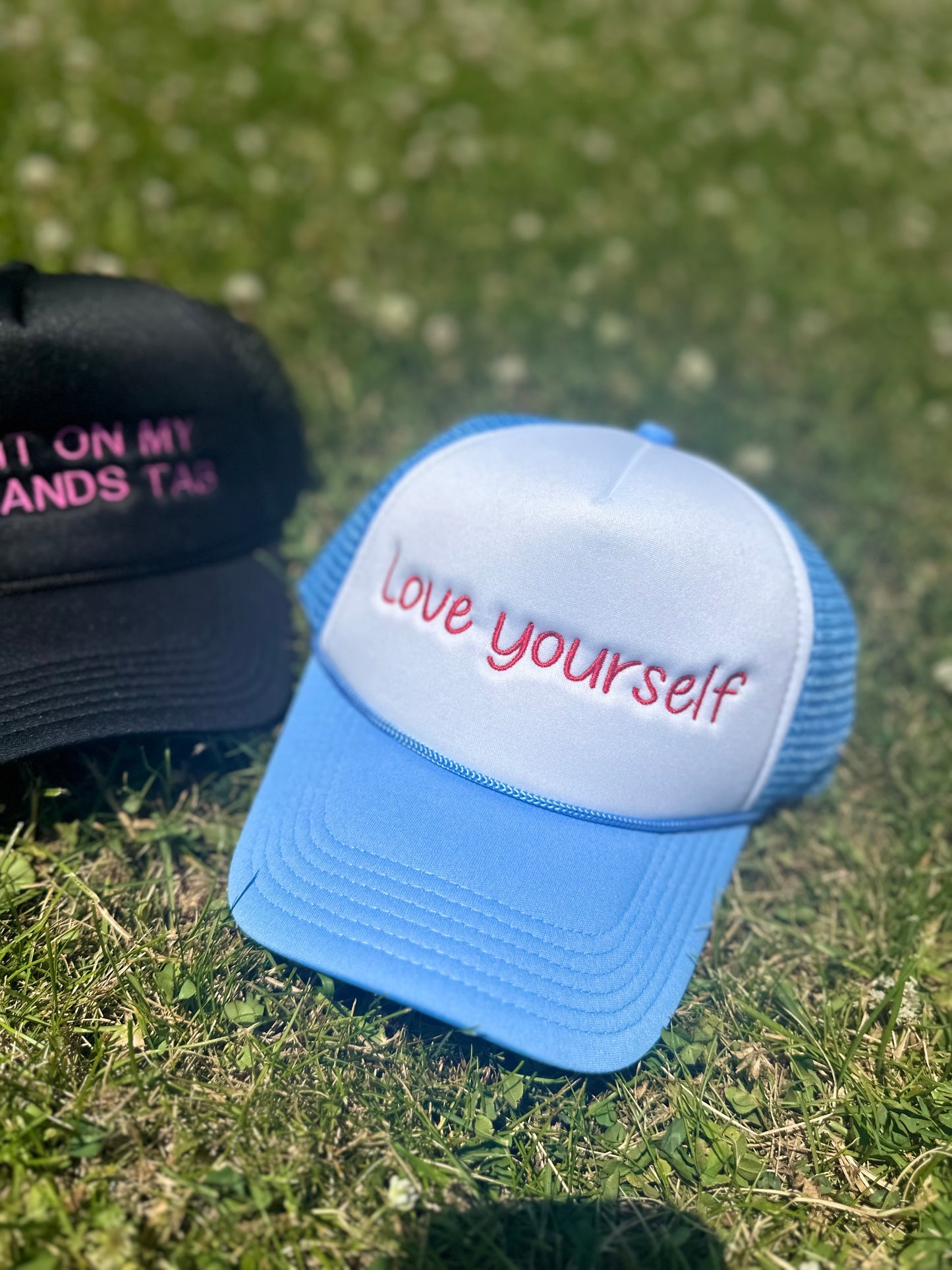 Love yourself Trucker Hat